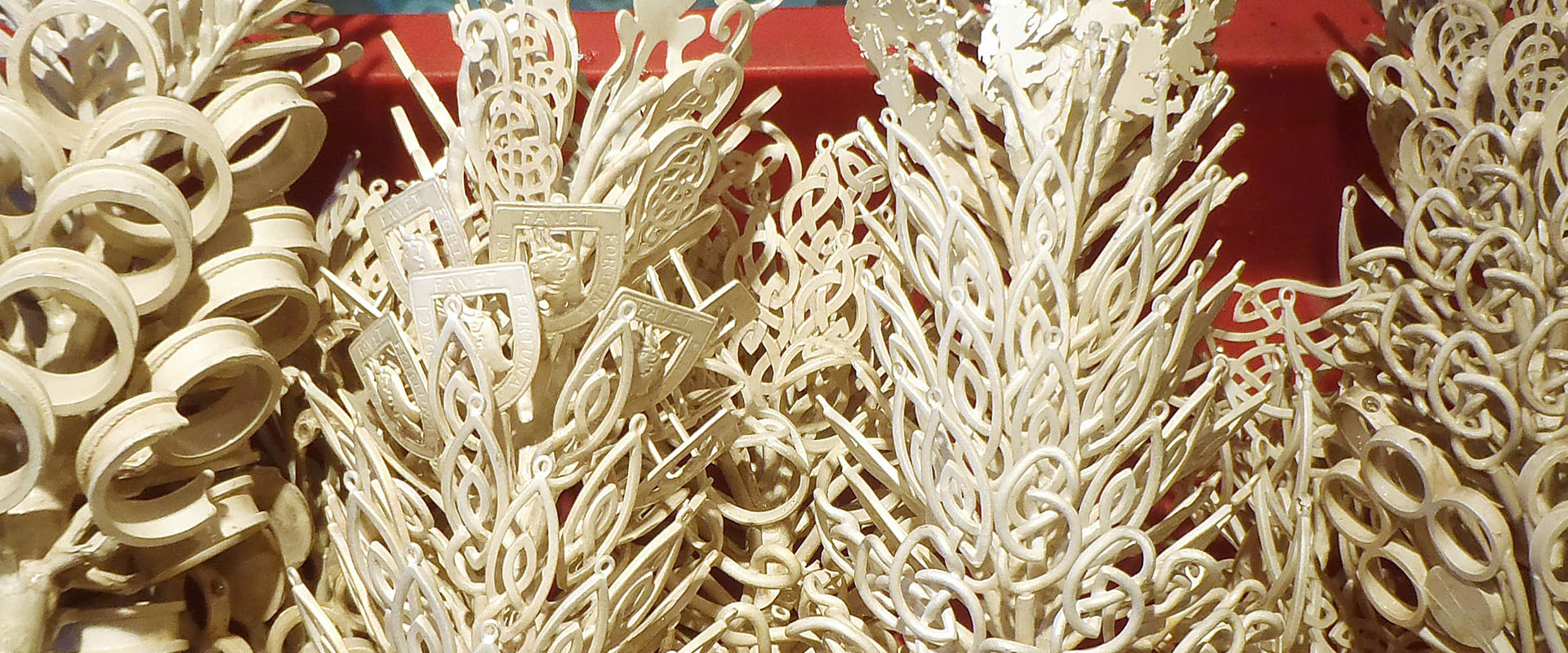 Bunches of ivory wax jewelry models ready for investment and casting